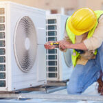 Air conditioning, technician or engineer on roof for maintenance, building or construction of fan hvac repair. Air conditioner, handyman or worker with tools working on a city development project job